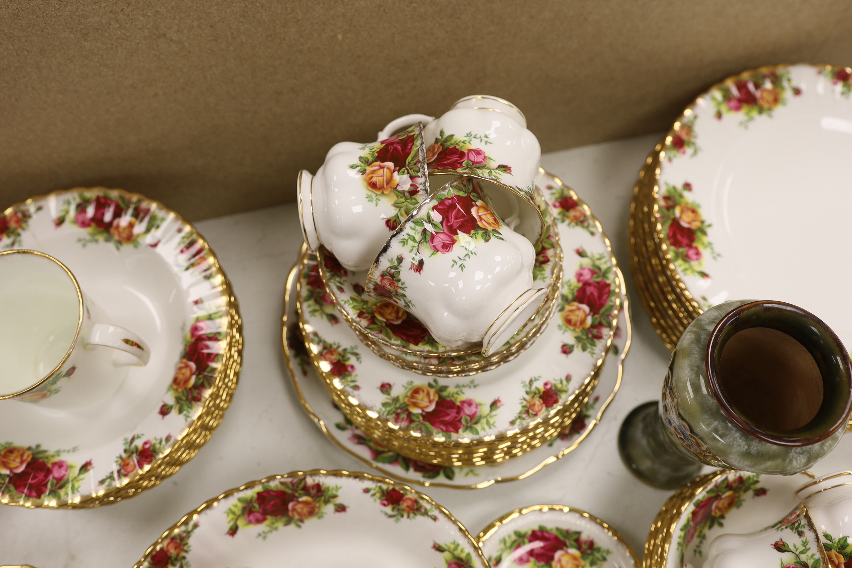 A Royal Albert Old Crown Roses dinner and tea service and a Doulton Lambeth vase